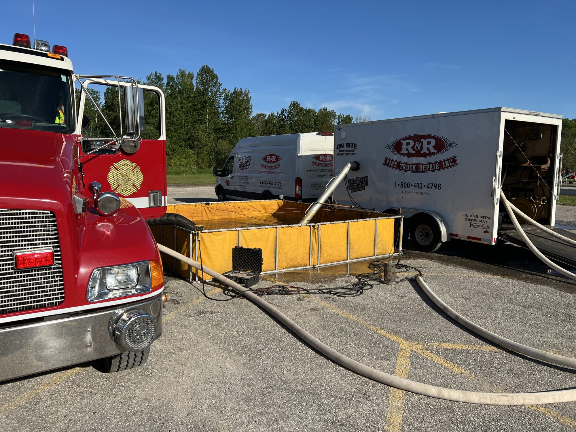 Fire truck and repair trailer with hoses