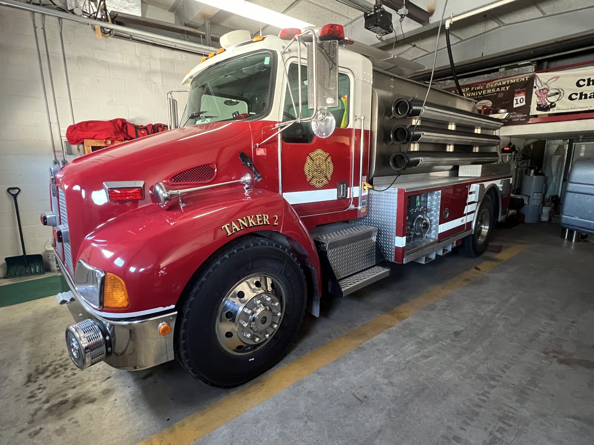 Red fire truck parked in garage